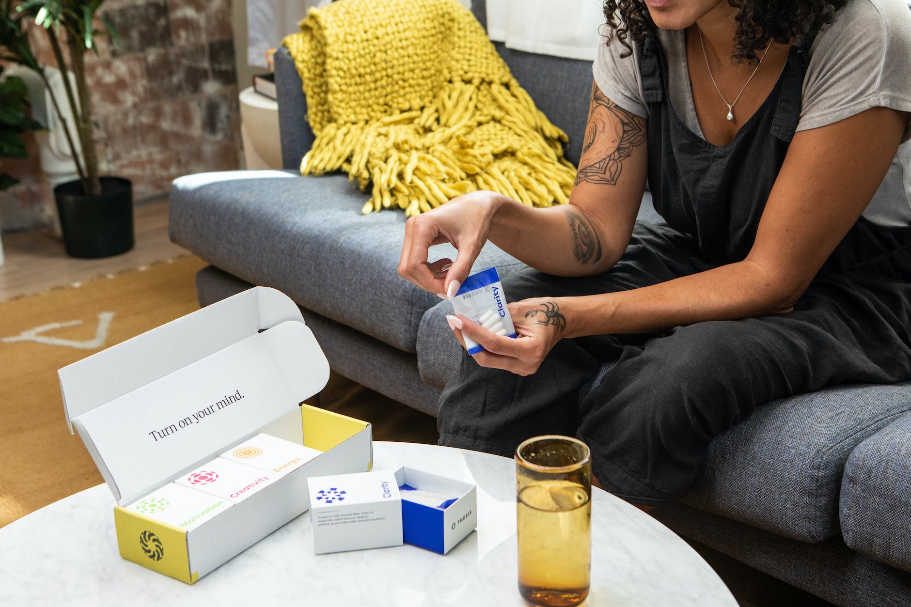 a woman taking health supplements at home